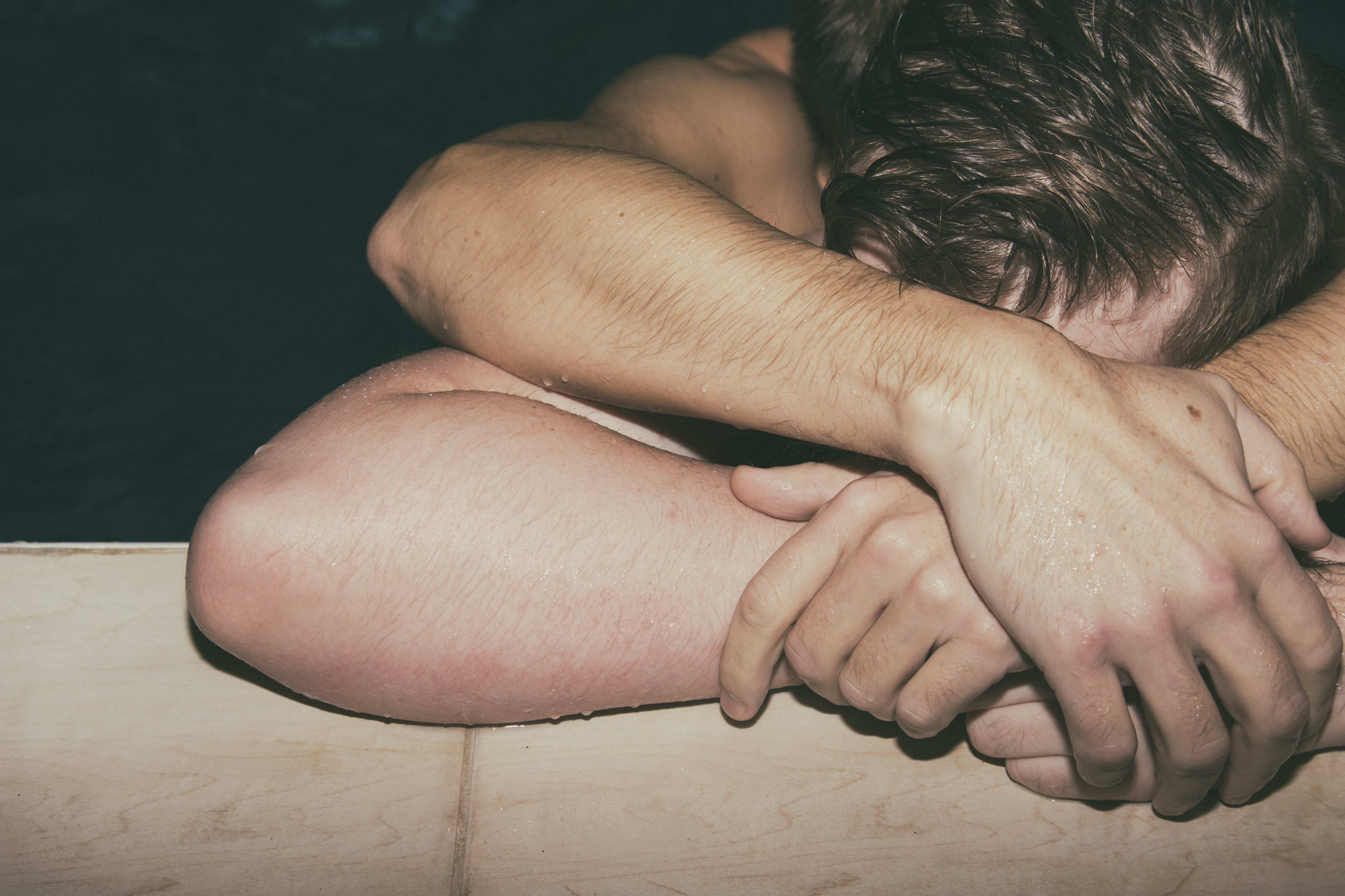 two men hugging in a pool