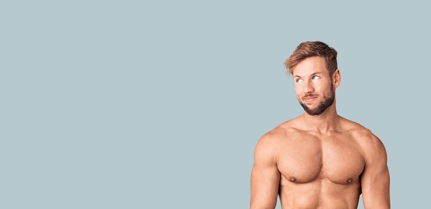 Cheeky man with a beard and no shirt on a light blue background
