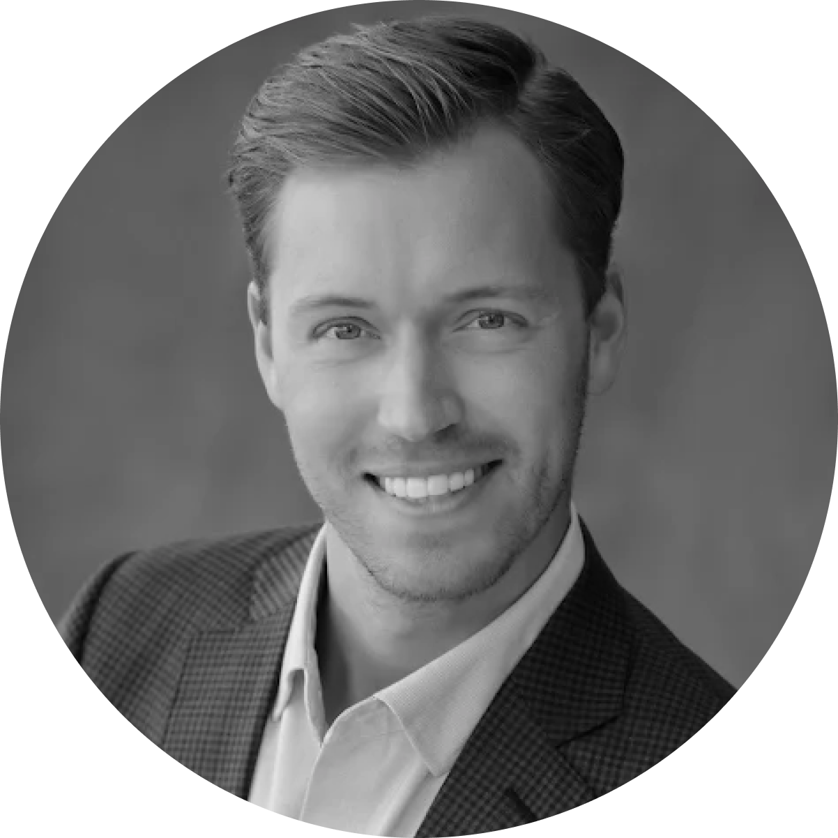 Black and white circular headshot of Paal Salvesen in a suit. 